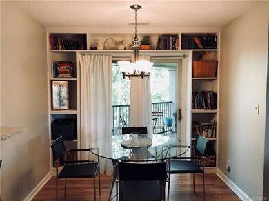 DINING AREA *******BRILLIANT IDEA    -----******ADDED CUSTOM CABINETS AROUND SLIDING DOORS TO SECOND DECK*****UPDATED LAMINATE WOOD FLOORING     MODERN LIGHT FIXTURE