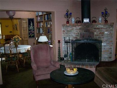 Original living room with beautiful curved brick f