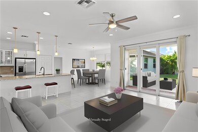 Living room with sliders to covered porch + views