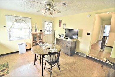Kitchen facing the side entrance door and to the r