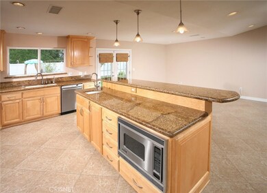 The chef in the family  is going to truly appreciate the gourmet family kitchens recessed lighting, abundant maple wood cabinetry, rich granite counter tops with back-splash, walk-in pantry, under-mount dual basin sink with modern faucet, Viking Prof