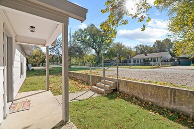 View of yard featuring covered porch