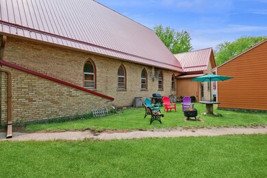 Arched windows and brick siding add to the beauty of this home.