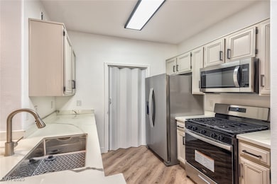 Kitchen with stainless steel appliances and light wood-type flooring