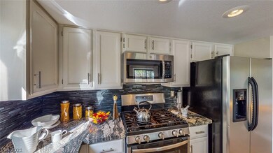 Professionally painted cabinets with brushed nickl