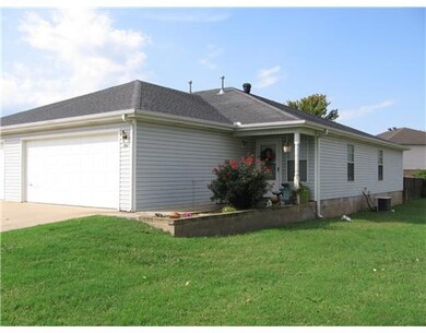 Exterior Front. Back yard privacy fences on both sides of duplex.