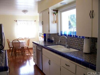 Bright Kitchen with never flooring and freshly pai
