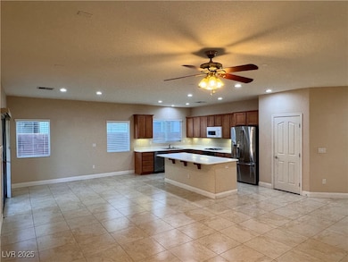 Kitchen featuring stainless steel fridge with ice
