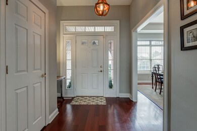 The Entry has the wood flooring, transom and sidel