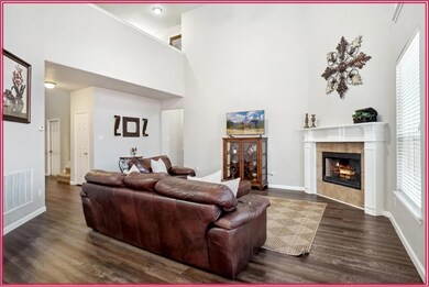 Living room with dark wood-type flooring, a tiled 