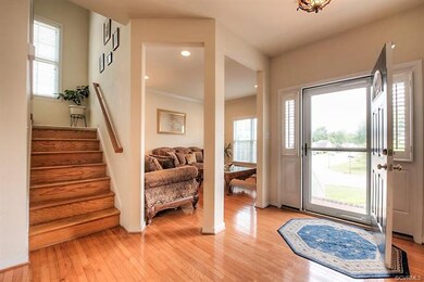 Beautifully finished hardwood floors & stairway.