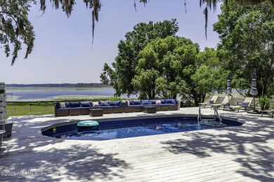 SPACIOUS POOL AND DECK OVER LOOKING LAKE