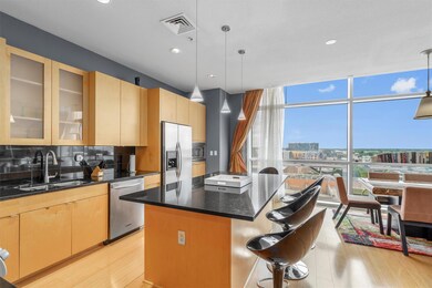 Kitchen with stainless steel appliances, a sink, 