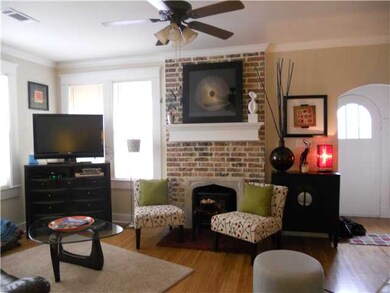 This light and airy living room has a lovely mantl