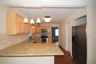 KITCHEN (View 1): Granite Countertops & Tile Backs