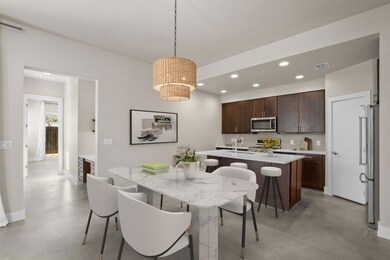 Dining area featuring baseboards, finished concre