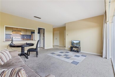 Living-dining area showing kitchen and entry hall