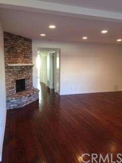 Gas fireplace, hardwood floors in large livingroom