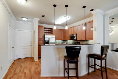 This photo showcases a cozy kitchen with a breakfa