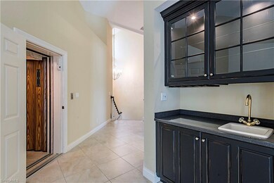 Upper Foyer with Wet Bar and Private Elevator