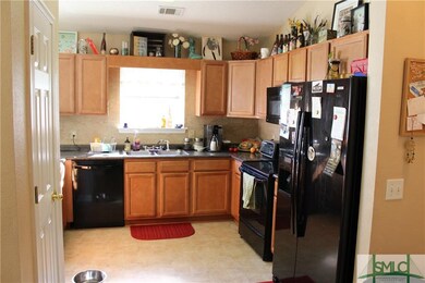 Kitchen has generous counter and cabinet space. Al