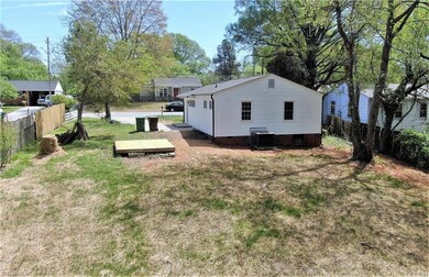 Backyard showing wooden platform for entertaining