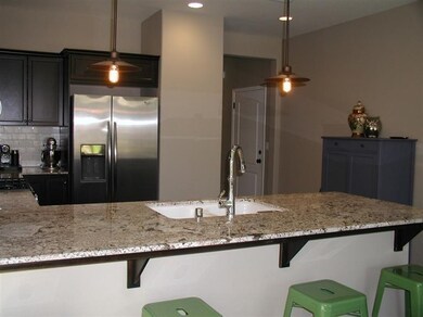 Gorgeous upgraded Granite breakfast bar, with over