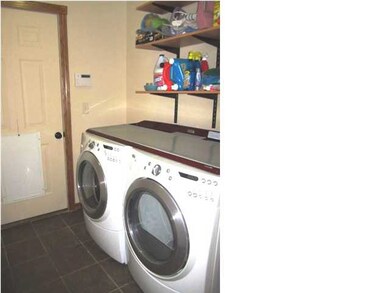 Main floor laundry in a separate room for added co