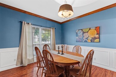 HUGE Dining Room with Crown Molding & Wainscot is 