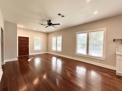Unfurnished living room featuring dark wood finis