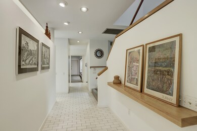 The entry steps down into the spine of the first f