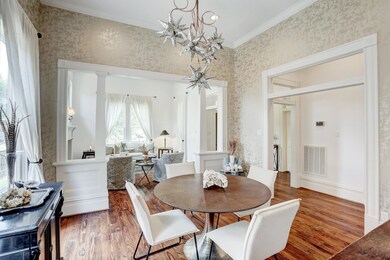 A beautiful wallpaper in neutral tones and an ecle