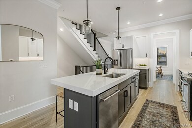 Gourmet Kitchen features dual tone cabinets (white/grey), quartz counters (3 inch thick on the island), 6-burner gas range, stainless steel hood, pantry, microwave, refrigerator, and dishwasher.