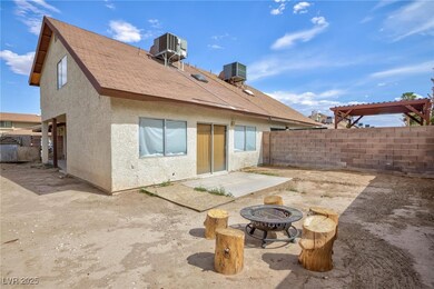 Rear view of property featuring central AC, fence,
