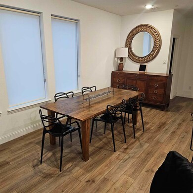 Dining room with hardwood / wood-style flooring