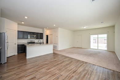 The beauty and versatility of the open floor plan design concept is yours to explore in the huge shared living/kitchen space. Fresh paint throughout graces the home.