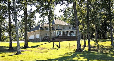 Great view of the back of the house. There are water faucets and electrical outlets located all around the outside and frost free water hydrants strategically located around the yard an shop to make watering lawn or animals easy.