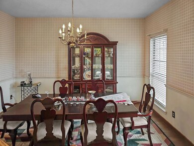Dining room with a notable chandelier and a health