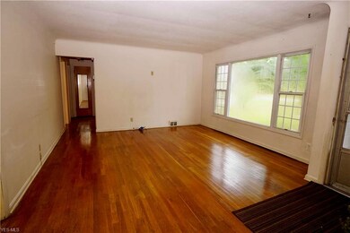 Light filled living room with hardwood floors