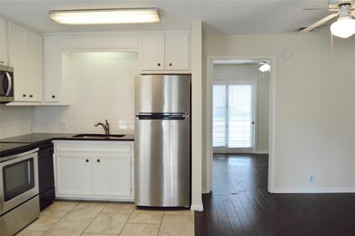 Kitchen featuring stainless steel appliances, dar