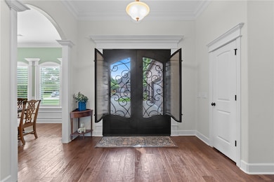 Notice the custom double entry iron doors