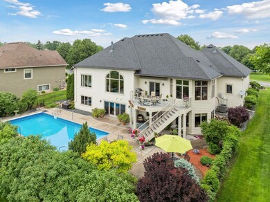 Welcome to 11565 Palisade Ct. NE in the sought after neighborhood of Deacon's Walk! This stunning one-story house boasts a walkout basement, a spacious upper deck, and a lower level featuring a pool and patio oasis!