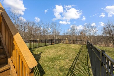 Walk down stairs to flat, grassy, fenced in yard t