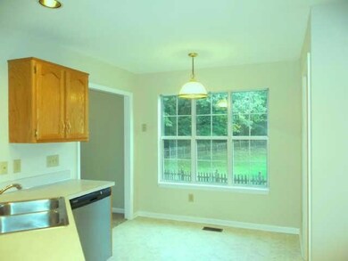KITCHEN WITH NEW STAINLES STEEL STOVE, DISHWASHER AND MICROWAVE INSTALLED 2014 AND EATING AREA WITH PICTURE WINDOW.