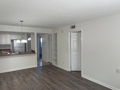 Kitchen featuring decorative light fixtures, white