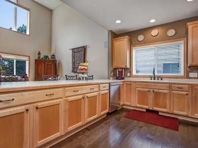 Large kitchen with breakfast bar is open to the gr