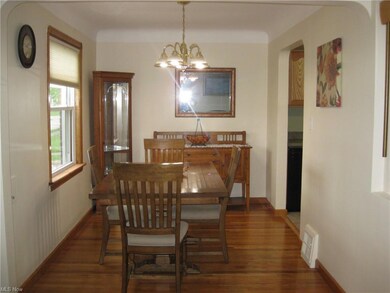 Dinning room w/custom blinds hardwood floors