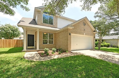 View of front of house with an attached garage, d