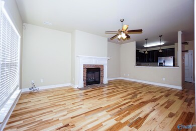 Brand new gorgeous real hardwood floors with gas fireplace. Open to kitchen bar, dining area and covered back porch for easy entertaining and relaxing. Surround sound speaker hookups pre-wired.