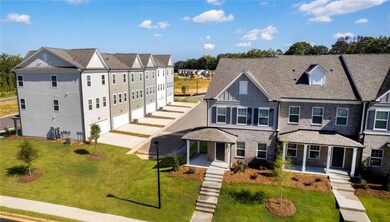 Townhome / multi-family property with a front yard